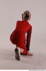 DENISA KNEELING POSE WITH GUN